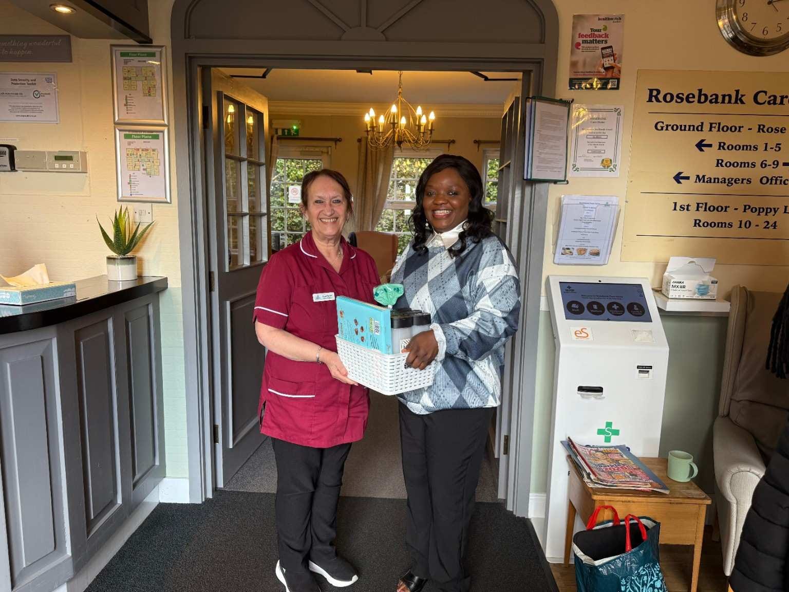 Presenting a Gift Items to the manager of RoseBank Care Home During Our Music Outreach Sheffield